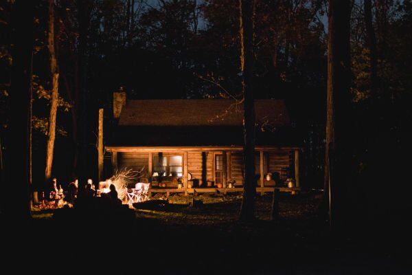 A summer cabin at night